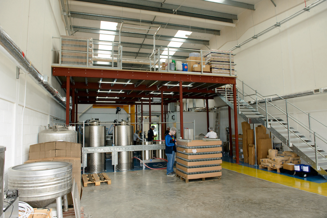 The Start Up Drinks lab bottling plant, a tidy and organised factory space.